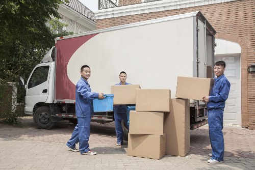 Furniture and boxes being unloaded during a flat removal in Surrey