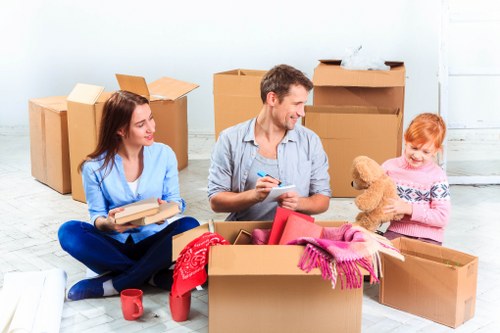 Removal team handling furniture during a Surrey home move