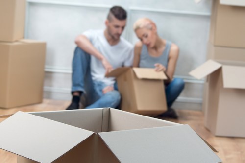 Professional movers packing boxes for a local relocation in Surrey