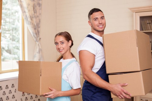 Well-packed household boxes and furniture in a Surrey storage space